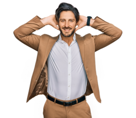 Young hispanic man wearing business clothes relaxing and stretching, arms and hands behind head and neck smiling happy