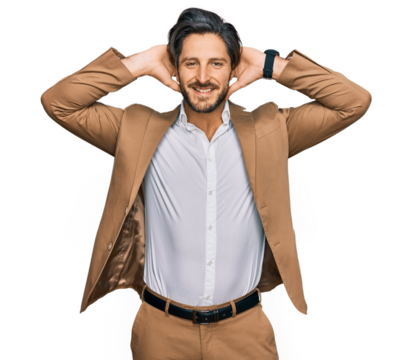 Young hispanic man wearing business clothes relaxing and stretching, arms and hands behind head and neck smiling happy