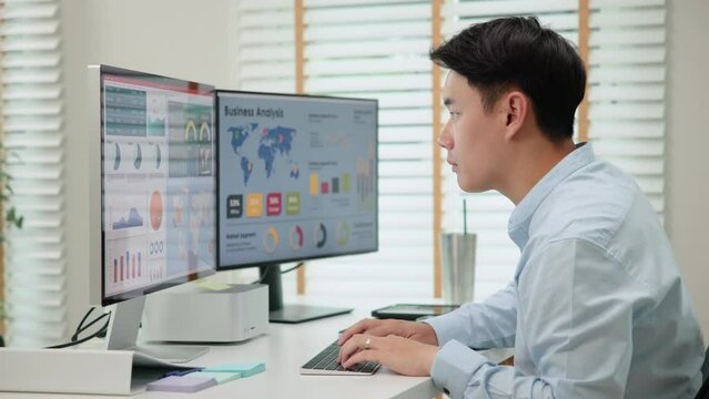 Asia people expert man tech talent working on project predict sales insight SEO graph chart AI smart plan visual big data science report center BI smart tools screen. Office worker asian analyst job.