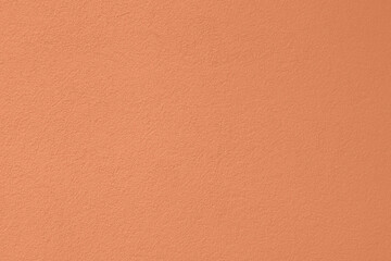 Peach Fuzz toned colour grunge decorative wall background. Art rough stylized texture banner trendy color 2024. Grunge Peach Fuzz color texture