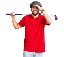 Young handsome man with beard playing golf holding club and ball stressed and frustrated with hand on head, surprised and angry face