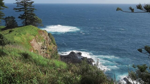 Static shot of crashing ocean waves on Norfolk Island Anson Bay Road