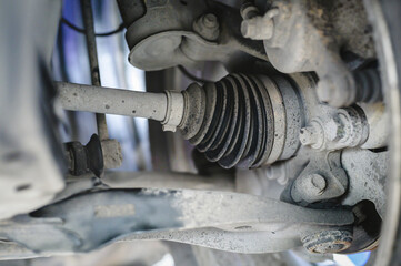 Close-up of  CV joint drive axle on a front wheel drive car.