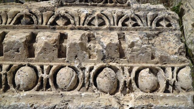 Close-up footage of stone carvings in Ancient Roman city in Baalbek, Lebanon