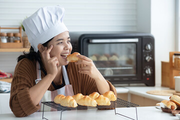 Happy homemade bakery chef, testing her freshly made bread