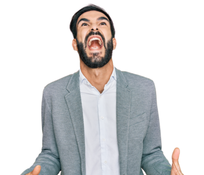 Young hispanic man wearing business clothes angry and mad screaming frustrated and furious, shouting with anger. rage and aggressive concept.