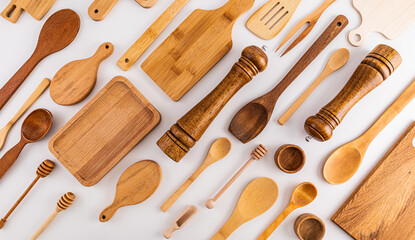 Kitchen wooden utensils, cooking tools on white background. Flat parallel diagonal layout. Kitchen background. cover. layout.