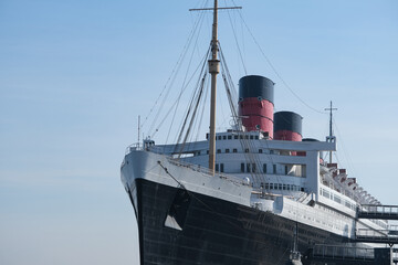 Naklejka premium World famous tourist destination and historic ocean liner cruiseship cruise museum ship hotel in port of Long Beach, California USA 