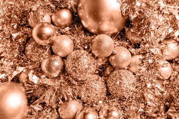 Christmas background of golden color from balls and tinsel