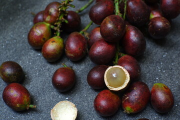 a bunch of matoa fruit