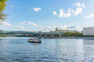 View of the Moscow river embakment, Pushkinsky bridge and cruise ships at sunset.