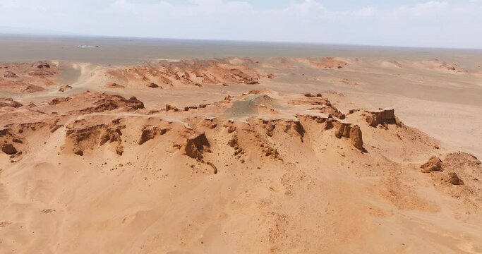 Sandstone Rocks - Flaming Cliffs (Bayanzag), Gobi Desert In Mongolia - Drone Shot