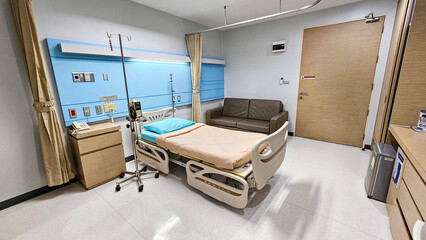 Hospital bed. Patient Bed. Empty hospital bed in hospital recovering room. Patient room. Electronically adjustable bed and facilities in an inpatient room. Hospital Ward