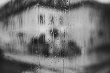 rain on the window. black and white toned image 