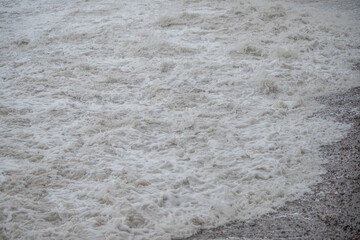 Large waves hit the shore. Storm at sea, storm warning on the coast. Thunderclouds and large sea...