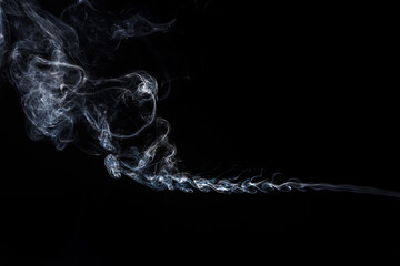 Abstract smoke on black background. Light blue texture. Design element. 