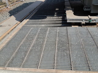 Grating top off concrete transformer foundation