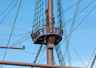 Mast on a ship against the blue sky