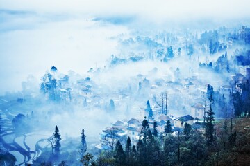 Rural town in the morning mist, Yunnan