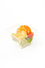 A small portion of vegetable salad on a white background