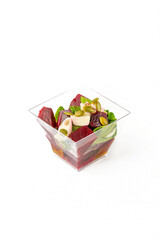 A small portion of vegetable salad on a white background