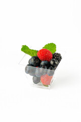 A small portion of fresh berries on a white background