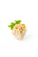A small portion of vegetable salad on a white background