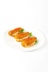 Sandwich with ham and red caviar on a white background
