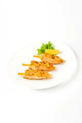Meat snacks on a white plate on a white background