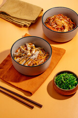 Asian rice noodles with vegetables, sauce and chicken in a bowl