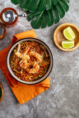 Traditional Asian noodles with vegetables, sauce and shrimp