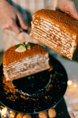 Woman baking Christmas Pavlova cake and New Year's honey cake