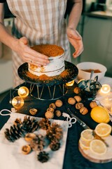 Woman baking Christmas Pavlova cake and New Year's honey cake