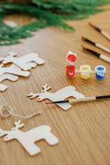 Handmade Rudolph decor in artistic close-up of festive craft table