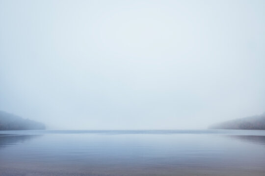 Peaceful Donnell Pond, Maine on a moody, foggy, misty fall day.