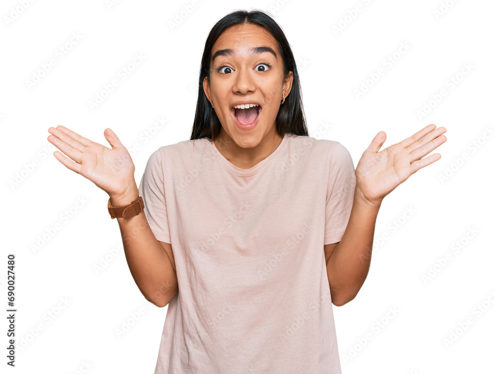 Sticker young asian woman wearing casual clothes celebrating crazy and amazed for success with arms raised a