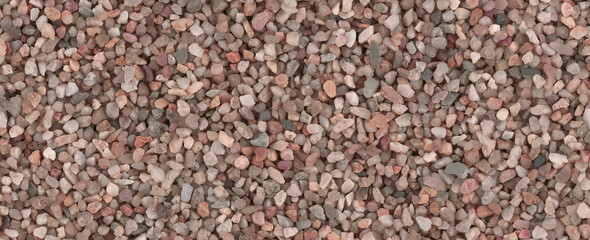 Small round stones background. Stone texture. Rough surface of small pebble stone.