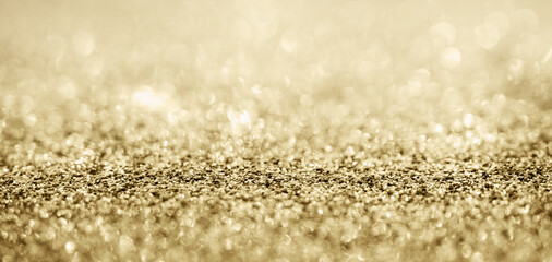Abstract gold glitter sparkle with bokeh background