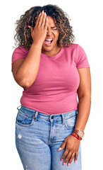 Young african american plus size woman wearing casual clothes yawning tired covering half face, eye and mouth with hand. face hurts in pain.