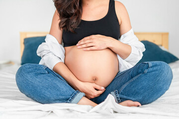 Pretty pregnant woman at home.