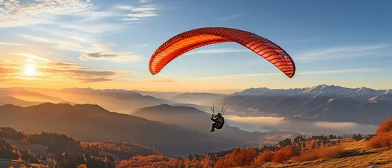 Fototapeten Man falling through a parachute in a clear blue sky. © tongpatong