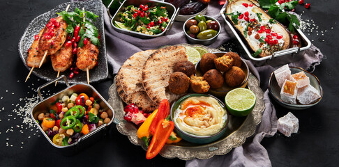 Middle eastern or Arabic different dishes on black background. Tasty traditional food concept