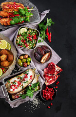 Middle eastern or Arabic different dishes on black background. Tasty traditional food concept