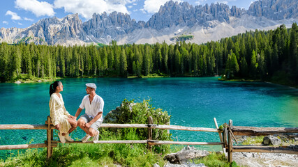Carezza lake Lago di Carezza or Karersee with Mount Latemar Bolzano South Tyrol Dolomites Italy. A...