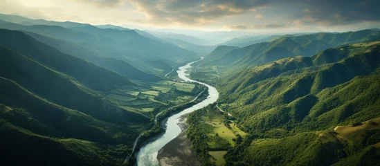 Fotobehang Aerial view river flowing water from mountain forest at Summer day © saifur