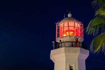 travel to Georgia - illuminated old lighthouse in Batumi city in autumn night