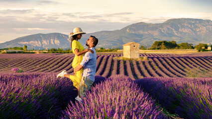 Provence Lavender Field France Valensole Plateau, a colorful field of Lavender at the Valensole Plateau Provence Southern France, a couple of men and women on summer vacation in France watching sunset