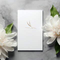 white card on a marble background with white flowers, wedding invitation concept