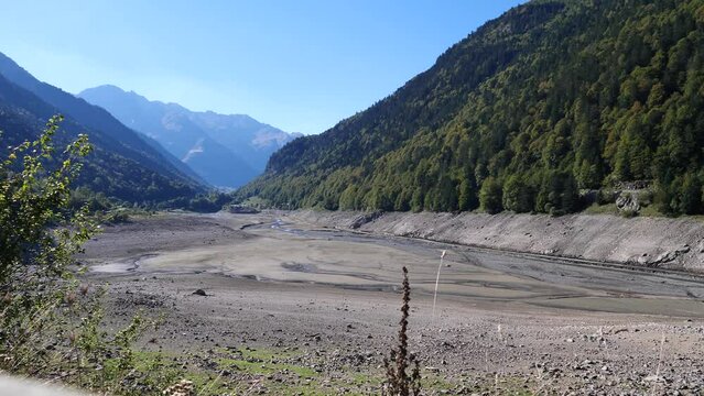 view of a valley in  pyrenees with empty lake Lac de Fabreges