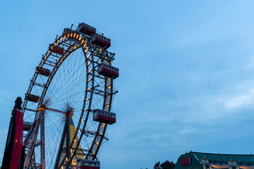 Giant ferris wheel against clear evening sky in Vienna, Austria.